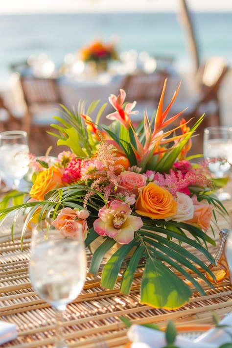 Beach wedding reception. Tropical floral centerpiece on bamboo tables.

Stunning ocean vistas, breezy cliffside beauty, the nautical charm of seashore treasures; coastal weddings have a magical allure of their own. If you're planning on saying 'I do' amidst the intoxicating salt-kissed air, then these 25 coastal wedding reception décor ideas are definitely a wave worth riding. From mesmerizing marine-inspired…

Read more: https://tastywed.com/25-coastal-wedding-reception-decor/ Tropical Centerpieces Wedding Receptions, Mexico Wedding Florals, Tropical Beach Wedding Ideas, Beach Tropical Wedding, Florida Themed Party, Coastal Garden Wedding, Tropical Centerpieces Wedding, Coastal Wedding Reception, Nautical Wedding Centerpieces