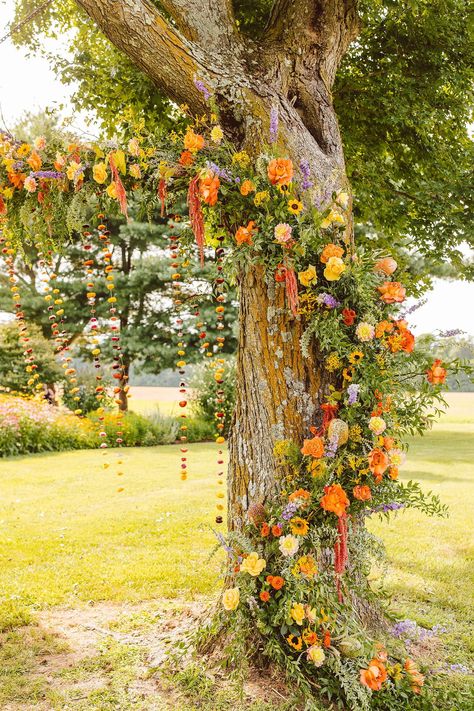 Colorful Boho Wedding Day Inspiration | Brooke Michelle Photo | Charlotte Wedding Photographer | wedding photographer, orange wedding palette, outdoor wedding, floral installation, flowers in tree | via brookemichellephoto.com Orange Tree Wedding, Lavender Orange Green Wedding, Orange Orchard Wedding, Summer Wedding Aisle Decor, Outdoor Wedding Tree Decor, Boho Wedding Arches, Eclectic Wedding Arch, Gazebo Flowers Wedding, Marigold Wedding Colors