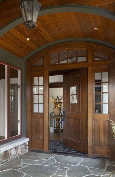 Inside a warm and inviting Minnesota lake house remodel on a woodsy setting Lodge Front Door, Bria Hammel Interiors, Curved Cabinets, Lake House Remodel, Front Foyer, Minnesota Lake, Cle Tile, Porch Doors, Long Lake