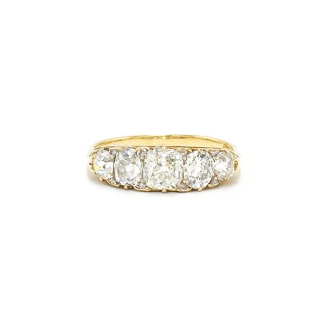 A graduated band is set with five old mine diamonds totaling approximately 2.50 carats accented with rose cut diamonds totaling approximately 0.10 carat mounted in 18 karat yellow gold. Circa 1890s. Four Stone Diamond Ring, 5 Stone Engagement Ring, Five Stone Engagement Ring, 5 Stone Diamond Ring, Brown Diamond Engagement Ring, Edwardian Diamond Ring, European Cut Diamond Ring, Fred Leighton, Vintage Inspired Engagement Rings