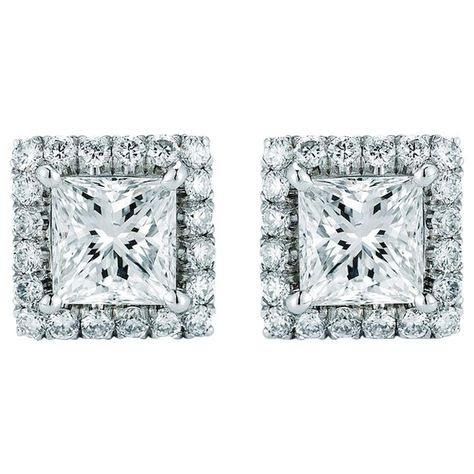 A pair of gorgeous princess cut pave set earrings are presented in classic sparkling diamond halos. These stunning and wonderfully wearable, high-quality ear studs rendered in gleaming white gold. Approximately 6mm wide. Material: 18K White Gold Center Diamonds: (2) Princess Cuts 0.40ct each Micro Pave Diamonds: 0.15 cttw Quality: E color, VS-SI clarity STYLE #E-10.PR. Princess Cut Halo, 2 Princess, Morganite Earrings, Peach Morganite, Rose Gold Morganite, Gem Earrings, Minimalist Studs, Set Earrings, Sparkling Diamond