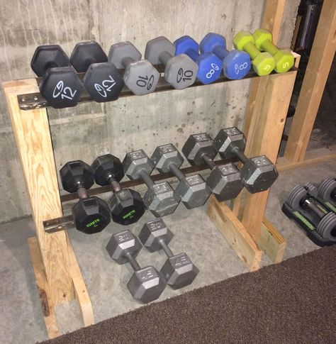 DIY Dumbbell Rack. I made this from scrap lumber and the iron rails are from an old bed frame. My total cost = $0.00! Diy Dumbbell Rack, Diy Dumbbell, Home Made Gym, Diy Gym Equipment, Home Gym Garage, Weight Rack, Gym Images, Diy Home Gym, Diy Gym