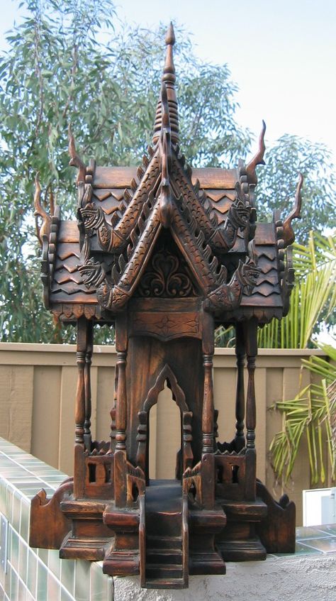 Thai Spirit House...brought two of these back from Thailand.  Can't wait to finish working on the landscaping so we can find the perfect placement for these. Spirit House, Thai House, Wood House, Asian Design, Thai Art, Asian Decor, Tree Sculpture, Ceramic Houses, Bird Cages