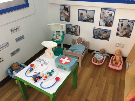 Baby clinic role play area Doctor Role Play Eyfs, Doctor Role Play Ideas, Doctors Role Play Area, Doctors Surgery Role Play Eyfs, Doctors Role Play, Doctor Play Area For Kids, Doctors Role Play Area Eyfs, Hospital Role Play Area Eyfs, Hospital Role Play