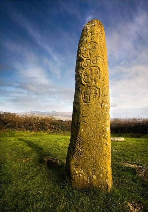 Kilnasaggart Pillar Stone, Co Armagh  Standing at 2.8 metres high the Kilnasaggart pillar stone is probably the oldest dateable stone monument in Ireland. The Pillar stands in a small enclosure in the townland of Edenappa in County Armagh. The Pillar stands at the edge of a graveyard that was excavated in the later part of the sixties, these excavations revealed both stone built and dug graves. There are several small stones lying around the standing stone and some of these stones bear crosses. Stone Monument, Ancient Ireland, Armagh, Standing Stones, Old Irish, Standing Stone, Sacred Stones, Visit Ireland, Irish History