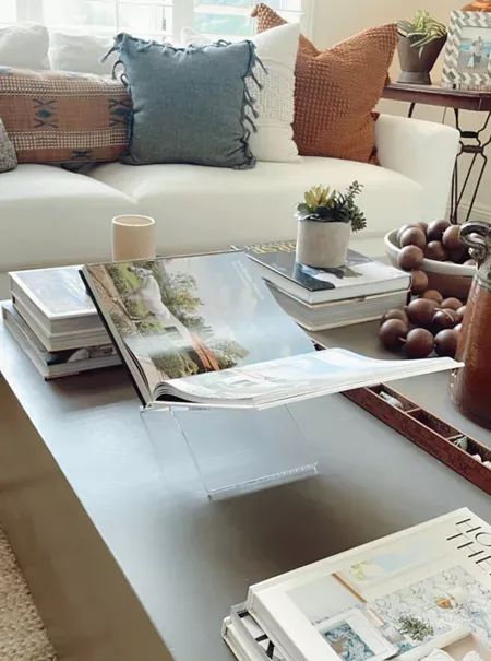 This book stand is one of my favorite coffee table accessories! Love leaving my book open to an inspiring page! #coffeetable #coffeetablestyling #coffeetabledecor #homestyling #homeideas #coffeetablebook #displaybook #ltkhome Coffee Table Styling Ideas, Table Styling Ideas, Coffee Table Accessories, Interior Finishes, Book Holder, Book Stand, Coffee Table Styling, Table Styling, Coffee Table Book