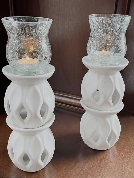 Candle holders fit any decor setting, but buying new and modern ones can sometimes be pricey. By using a few items from the Dollar Tree you can make this chic and inexpensive tea light candle holder. For this project you will need four oil burners and two crackled glass tea light holders from the Dollar Tree. You can find all of the materials in the candle aisle of The Dollar Tree. You can also opt to choose a different style of tea light holder. I chose the crackled ones to give… Candle Aisle, Dollar Tree Candlesticks, Diy Tea Light Candle Holders, Candle Makeover, Dollar Tree Candle Holders, Aisle Candles, Candle Holder Diy, Diy Candle Sticks, Dollar Tree Projects