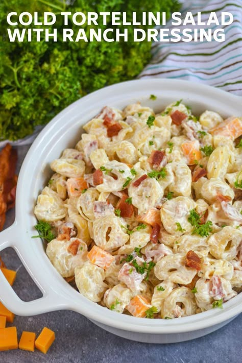 Too hot for pasta? Think again with this creamy cold tortellini salad with ranch dressing. Loaded with big bites of cheddar cheese, pieces of crumbled bacon, and cheese tortellini, this pasta salad recipe is anything but ordinary. A handful of ingredients and a quick 20 minutes and this cold tortellini salad is ready to go.  #tortellinisalad #coldsalad #dinnerecipe Bacon Ranch Tortellini Pasta Salad, Tortellini Sides Dishes, Cold Tortellini Salad Recipes, Cheese Tortellini Salad Recipes, Ranch Tortellini Pasta Salad, Cheese Tortellini Salad Cold, Pasta Salad With Cheese Tortellini, Cold Pasta Salad Recipes Tortellini, Chicken Tortellini Salad Cold