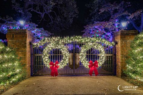 Entrance Gate Decorated in Christmas Lights and Greenery Gate Christmas Decorations Ideas, Gate Christmas Decorations, Christmas Gate Decorations Outdoor, Christmas Entrance, Gate Lights, Christmas Lights Outside, Outdoor Gate, Gate Decoration, Modern Farmhouse Wall Decor