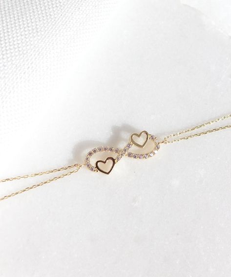 A symbol of infinite love, this elegant bracelet showcases the symbols of love and eternity entwined with each other. The heart motifs perfectly complements the infinity symbol for a truly romantic look. 14K Solid Gold Heart and Infinity Symbol Bracelet, Unique Double Heart Eternity Bracelet, Bridal Wedding Jewelry, Valentine's Day Gift Person Aesthetic, Heart And Infinity, Power Jewelry, Permanent Bracelet, Delicate Gold Bracelet, Eternity Bracelet, Gold Bracelet Simple, Gold Heart Bracelet, Necklace Chain Types