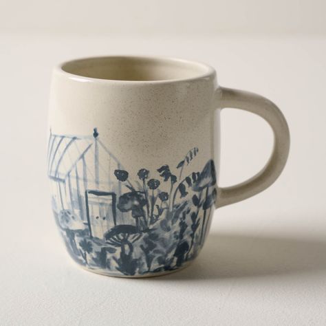 Inspired by one of Jo's favorite mugs, our greenhouse mug is just right for sipping a morning cup of coffee on the front porch. Painted in-house and finished with a speckled glaze, this mug features a watercolor scene reminiscent of Jo's garden. Pretty Coffee Mugs, Cottage Core Ceramics, Magnolia Greenhouse, Ceramic Pottery Painting Ideas, Watercolor Ceramics, Carved Mug, Silos Baking Co, Magnolia Kitchen, Morning Cup Of Coffee