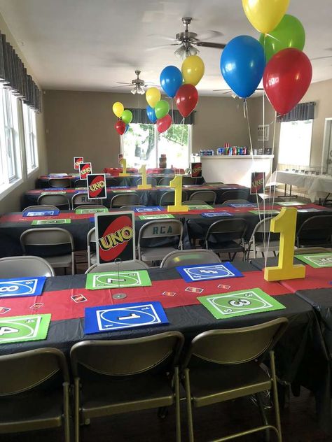 Sebastian’s 1st Birthday  | CatchMyParty.com Uno Game Party Ideas, Uno Themed Birthday Party, Uno Card Themed First Birthday, Uno Tournament Party Ideas, Uno Party Theme, Uno Party Ideas, Uno Card Game Birthday Party Theme, Uno Centerpiece, Uno Party Decorations