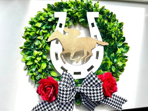 Boxwood wreath features a horseshoe, horse & jockey & roses.  Boxwood is artificial.  It measures 21".  Ribbon may differ slightly than what is shown. Derby Wreath, Kentucky Derby Themed Party, Horse Jockey, Boxwood Wreath, My Old Kentucky Home, Derby Party, Louisville Ky, Door Wreath Hanger, Kentucky Derby