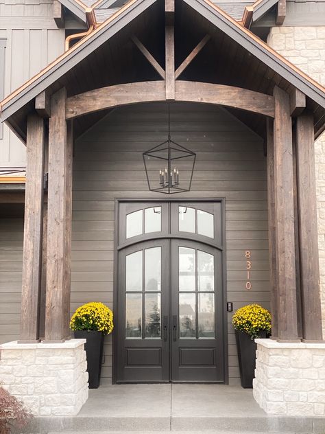 Black Magic Sherwin Williams, Urbane Bronze Exterior House, Sherwin Williams Black Magic, Sherwin Williams Black, Farmhouse Entry Table, Urbane Bronze, Exterior Paint Color, Staircase Railings, Curved Staircase