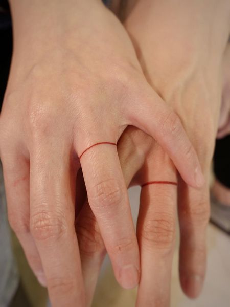 Promise Ring Tattoo Couple, Matching Wedding Tattoo Ideas, Red String Finger Tattoo, Man Ring Tattoo, Red String Ring, Red String Tattoo Couple, Ring Tattoo Couple, Couple Ring Tattoos Marriage, Red Knot Tattoo