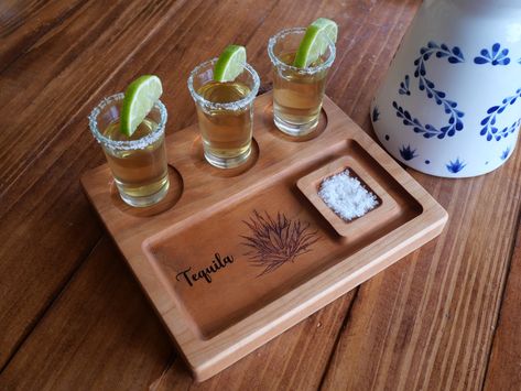 "- Perfect gift : Tequila Flight Board are designed for every connoisseurs of fine spirits.This is a great tequila gifts for men or women.It also is the perfect gift for numerous occasions including,Anniversary Gift,Father's Day, Mother's Day,bachelor party or groomsmen gift and a must-have for home bars and man caves! is handcrafted from 100% wood and Custom engraved by hand in our Florida workshop. - These are handmade so not everyone will look exactly the same. - Size are 8\" x 6.75\" x .94 \ Tequila Gift Idea, Drink Flights, Tequila Gifts, Flight Board, Tequila Gift, Home Bars, Drinks Tray, Party Trays, Man Caves