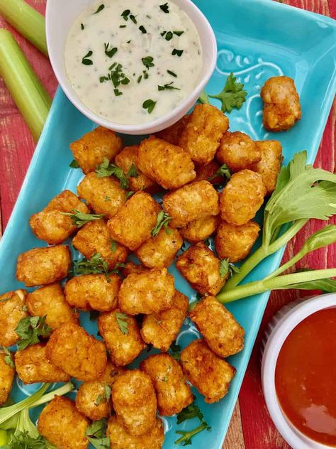 Buffalo Wing flavored tater tots with a creamy garlic, Blue cheese dipping sauce is perfect for game day or any day! Easy appetizer recipe! Tator Tot Recipe, Blue Cheese Dipping Sauce, Tater Tot Recipes, Tator Tots, Easy Appetizers, Tater Tots, Homemade Chili, Orange Recipes, Easy Appetizer Recipes