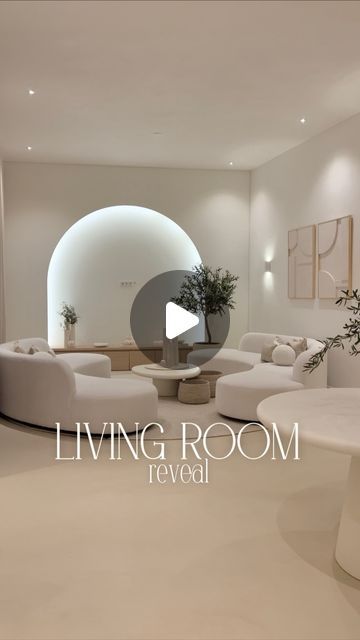 Armine Isajan on Instagram: "LIVING ROOM REVEAL 🕊️🥺 For the living room we wanted to create a big open space with a lot of calmness & comfort 🤍 We don’t like watch tv but if we watch movies we use our beamer & project it on our custom cinewall @caminoflames 🎬🫶🏽 Round “cinewall” @caminoflames Wall art @studio.lde Curtains + carpet @a_floors_ Wooden cabinet @maatkastenonline.be Couches @richmondinteriors Table @richmondinteriors Olive tree @bloomboutique.nl Set of 3 vases @purovivere Pillows @maisonmanon Cast floor @behaaglijkwonen Mirrors are @glassfactory_fi @lasitehdas   But @studioyba custom made the white frames how beautiful ?! 🥺🤍 #livingroom #livingroomdecor #japandi #japandistyle #japandiinterior #house #home #houserenovation #interieur #interior #interiordesign #arch Japandi Living Room Tv Wall, Arch Tv Cabinet, Arch Tv Wall, Japandi Living Room Tv, Japandi Tv Wall, Tv Area Ideas Living Room, Curved Tv Wall, Rooms Inspiration, Round Carpet Living Room