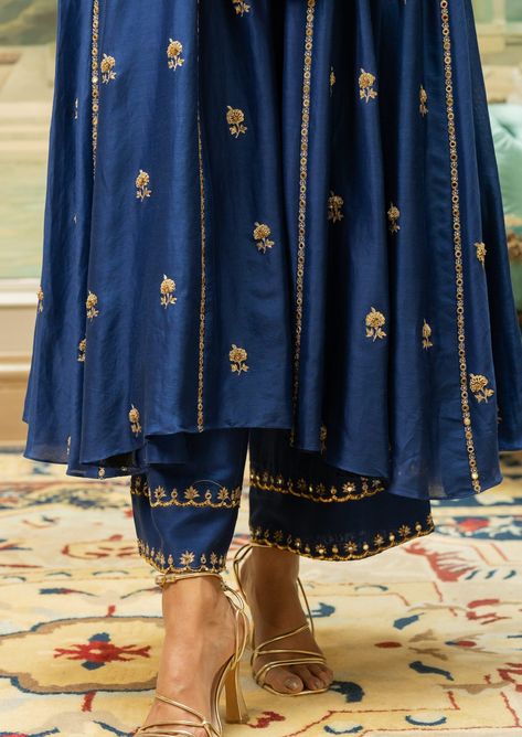 Featuring an electric blue kurta set paired with pants heavily embroidered with our signature motifs and antique gold detailing.