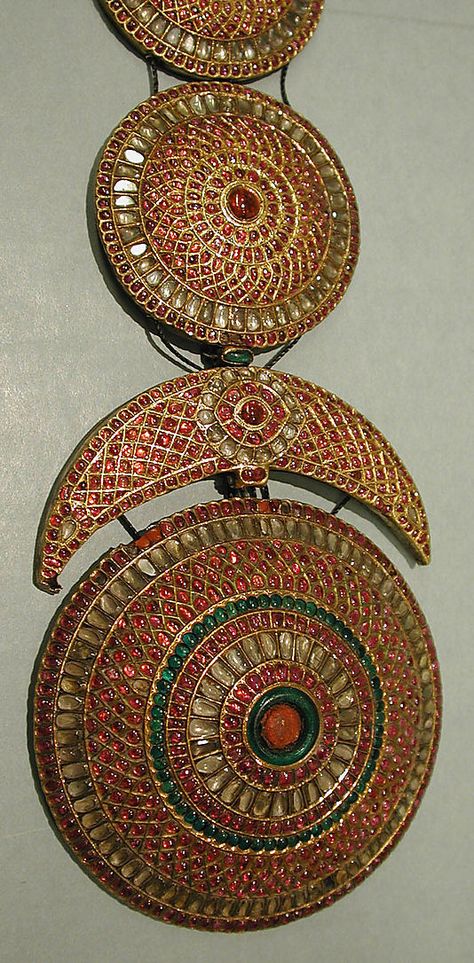 Plait Ornament (Jadanagam). Head ornament. 18th–19th century. India, probably Madras. Gold; inset with rock crystal, rubies, emeralds, and amethysts Gold Jada, The Sun And The Moon, Sun And The Moon, Ancient Jewellery, Traditional Indian Jewellery, Antique Jewellery Designs, Antique Jewelry Indian, Crescent Shape, Polki Jewellery