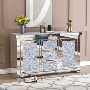 Mirrored Venetian Credenza. Beautifully hand engraved floral scrolls on antique mirror panels. Interior and base in gloss Ivory lacquered wood. 3 center drawers and 2 outer doors. Made in Italy. | David Michael Venetian 59" Credenza in Gray, Size 32.0 H x 59.0 W x 24.0 D in | Wayfair Glass Sideboard, Buffets And Sideboards, David Michael, Sofa End Tables, Acme Furniture, Sideboard Furniture, Furniture Deals, Sideboard Cabinet, 3 Drawer