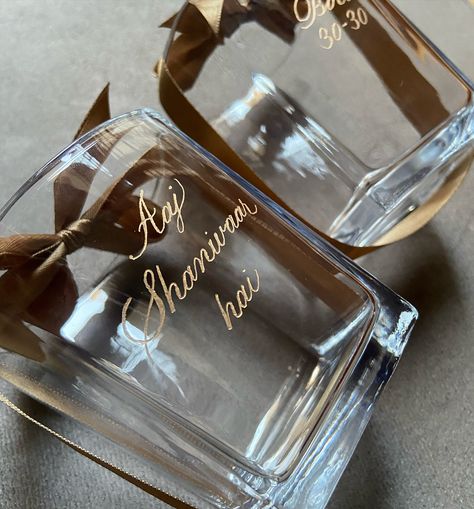 Engraved whiskey glasses✨ A gift as unique as the recipient, customised just for them 🌟 . . . . . . . . . . . #inkyhandbykamar #engravedgifts #engravedwhiskeyglass #luxurygiftingideas #delhicalligrapher #calligrapherdelhi #delhiartist #onsiteengraving #delhiluxurygifting #engravedchampagneflutes | inkyhandbykamar | inky.hand | Delhi Calligrapher | Delhi engraving artist | on-site calligraphy artist | on-site engraving artist | engraved whiskey glasses | luxury gifting | live engraving | e... Engraving Pen Ideas, Calligraphy Engraving, Engraved Champagne Flutes, Glasses Luxury, Textiles Gcse, Engraving Pen, Engraved Whiskey Glass, Pen Ideas, Calligraphy Artist