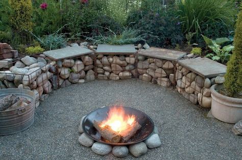 A gabion is a cage, cylinder, or box filled with rocks, concrete, or sometimes sand and soil. It is a great way to decorate your outdoor area with gabion. Gabion Retaining Wall, Gabion Wall, Stone Fire Pit, Fire Pit Seating, Garden Fire Pit, Fire Pit Area, Fire Pit Designs, Backyard Fire, Fire Pit Backyard