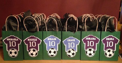 Soccer Goody Bags I made for Lucas' 4th Grade Classmates. Purple Jerseys for the girls and Blue Jerseys for the boys, with their name and the #10 in honor of his 10th Birthday, and of course, a soccer ball. Lucas' 10th Birthday 2014 Soccer Goodie Bag Ideas, Soccer Party Goody Bag Ideas, Soccer Party Bags Ideas, Soccer Theme Goodie Bags, Soccer Birthday Goodie Bag Ideas, Soccer Goodie Bags, Soccer End Of Season Gift Treat Bags, Soccer Gift Bags, Kids Football Parties