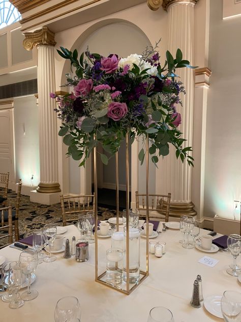 Deep Purple Centerpieces, Purple Gold And White Centerpieces, Purple Centerpiece Tall, Purple Floral Centerpieces, Purple Wedding Flowers Centerpieces, Tall Gold Vases, Dark Purple Wedding, Gold Wedding Centerpieces, Purple Wedding Centerpieces