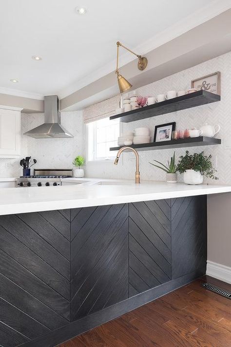 Black wood herringbone trim accents a kitchen peninsula fitted with a white quartz countertop holding a sink with a brass gooseneck faucet in a corner. Backsplash With White Cabinets, Replacing Kitchen Countertops, Kitchen Peninsula, Bright Kitchen, Kitchen Countertop Materials, Herringbone Backsplash, Kitchen Transformation, Quartz Countertop, Kitchen Corner