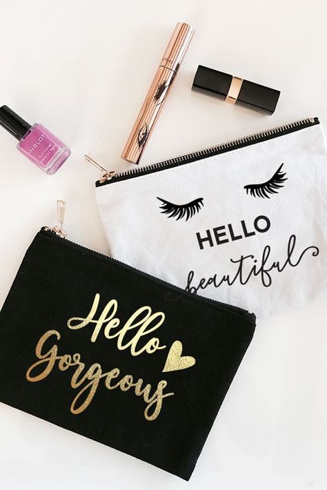 The Hello Themed Canvas Cosmetic Bags are a fun and unique touch to packaging your bridal party gifts to thank your friends or as a gift alone. Fill with custom lip balms, sunglasses, and more! The cosmetic bags are offered in 4 different designs in either black with metallic gold foil design or white with black graphic design. Features Facts: Cotton Canvas Gold zipper closure 6" H x 8.5" W. Wipe clean with damp cloth Themed Makeup, Bridal Party Totes, Personalized Cosmetic Bags, Cute Makeup Bags, Gold Foil Design, Makeup Tip, Idee Cricut, Sac Diy, Black Cosmetics