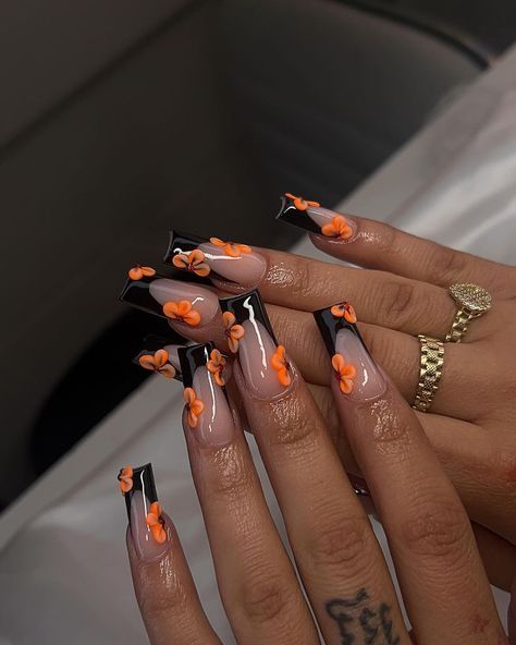 #blacknails #nailart #nailtech #orange #flowers #nailsart #orchids #naildesign #summernails #fashion #style #summervibes #inspo Black Tip Nails With Flowers, Acrylic Nail Designs September, Simple Baddie Nails Almond, Nail Ideas Orange And Black, French Tip With Acrylic Flowers, Orange Nail Designs Fall Autumn, Fall Nail Short Square, Black N Orange Nails, Halloween Color Nails Acrylic