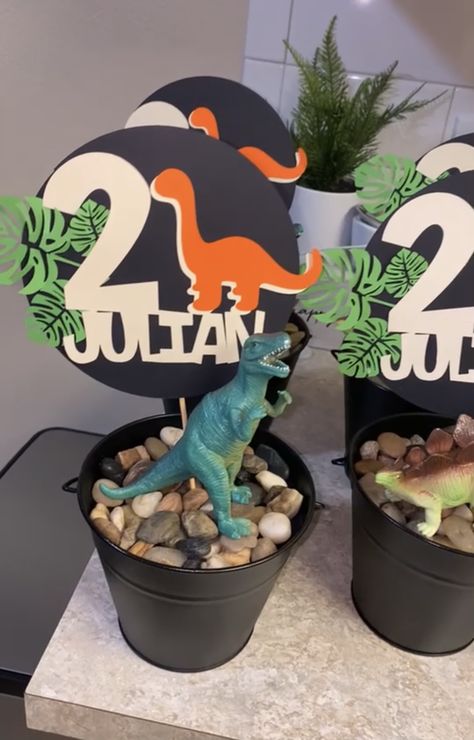 Dinosaur Birthday Party Centerpieces Diy, Centerpieces Dinosaur Party, Jurassic Park Centerpieces Diy, Dino Birthday Party Centerpieces, Dino Theme Centerpiece, Trex 3rd Birthday, Dino Themed Centerpieces, Diy Dinosaur Centerpieces Ideas, Three Rex Centerpieces