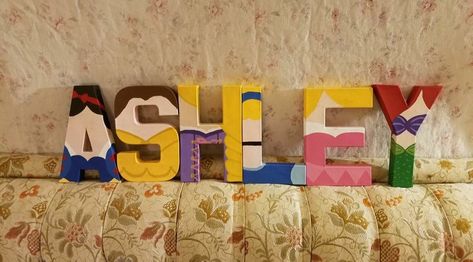 Painted Name Letters, Princess Letters Alphabet, Disney Name Sign, Disney Characters Letters, Winnie The Pooh Painted Name Letters, Disney Painted Letters, Disney Princess Letter, Letter Painting Ideas Wooden Disney, Disney Princess Theme Birthday Party