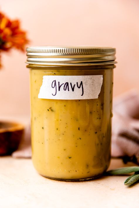 This Make Ahead Turkey Gravy infuses homemade gravy with fresh herbs for amazing rich & aromatic flavor. Prep up to 5 days in advance & reheat before the big meal – a much-needed holiday dinner timesaver! This easy, totally foolproof gravy recipe pairs with everything, from mashed potatoes to stuffing! Perfect Thanksgiving, Friendsgiving, or a simple Sunday roast chicken! #gravyrecipe #gravyfromscratch #makeaheadthanksgivinggravy #gravyfromdrippings #thanksgivingrecipes #thanksgivingsidedishes Turkey Gravy Without Drippings, Make Ahead Turkey, Gravy Without Drippings, Make Ahead Gravy, Sunday Roast Chicken, Reheat Turkey, Make Ahead Turkey Gravy, Make Ahead Thanksgiving, Gravy From Scratch