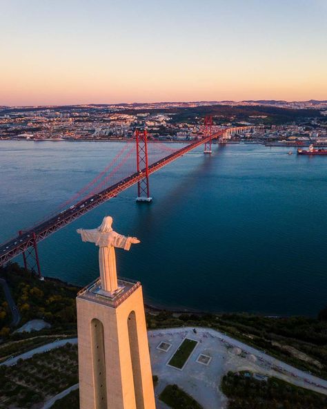 Christ the King and the 25 de Abril bridge. The Ponte 25 de Abril is a massive red suspension bridge in Lisbon, Portugal. It’s often mistaken for the Golden Gate bridge, as they look a lot alike.Want to see it for yourself?This guide has everything you need to know to plan your visit, including the best viewpoint.Let’s jump right in! Golden Gate Bridge Wallpaper, Lisbon Hotel, Portugal Vacation, Christ The King, Visit Portugal, Suspension Bridge, Famous Landmarks, Portugal Travel, Lisbon Portugal