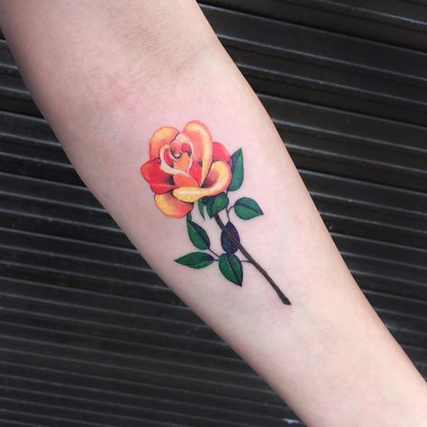 Orange rose tattoo by Zihee.   Rose tattoos are one of the most sought after tattoos in the world and has always been a classic symbol of beauty, balance and love. Enjoy! Orange Rose Tattoo, Rose Bud Tattoo, Yellow Rose Tattoo, Yellow Rose Tattoos, Tato Tradisional, Tattoo Roses, Rose Tattoo Forearm, Rose Tattoo Meaning, Pink Rose Tattoos