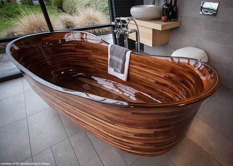 Our final favorite find from KBIS this year may be the most beautiful one. This gorgeous bathtub, part of the Lotus Bath Collection by NK Woodworking & Design, is handcrafted from sustainable hardwoods and finished with a specialized clear composite barrier. #housetrends Custom Bathtub, Wood Tub, Wood Bathtub, Wooden Bathtub, Beautiful Bathtubs, Wood Bath, Wooden Bath, Bathtub Design, Into The Wood