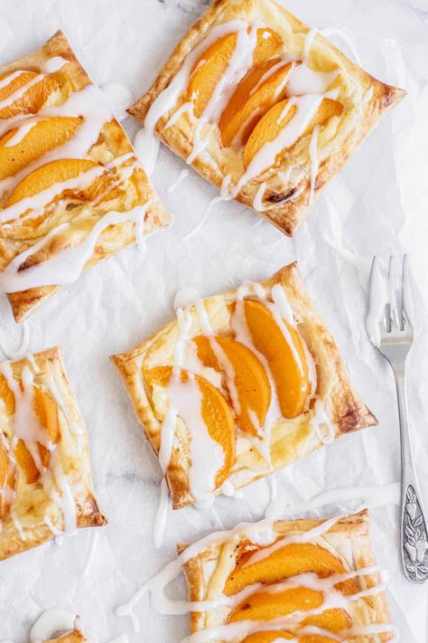 bird's eye view of peach danish pastries. Peach Danish, Cherry Cake Filling, Peach Dessert Recipe, Peaches Cream Cheese, Blueberry Cake Filling, Cream Cheese Danish Recipe, Cheese Danish Recipe, Danish Pastries, Rough Puff Pastry