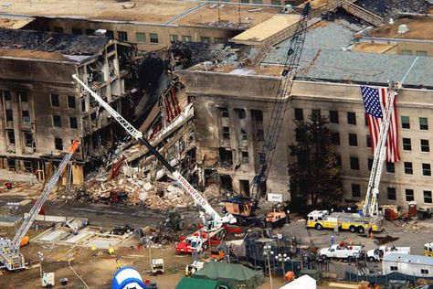 An aerial view of the damage at the Pentagon two days after Sept. 11, 2001. On that day, five members of al-Qaida, a group of fundamentalist Islamic Muslims, hijacked American Airlines Flight 77, a Boeing 757-200, from Dulles International Airport just outside Washington and flew the aircraft and its 64 passengers into the side of the Pentagon. (Tech. Sgt. Cedric H. Rudisill/U.S. Air Force photo) The Dictator, Into The West, Skid Row, The Pentagon, We Will Never Forget, Twin Towers, Lest We Forget, Aerial Photo, World Trade