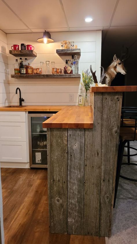 Rustic barnwood wet bar, shiplap walls, butcher block countertop, barnwood floating shelves Floating Butcher Block Countertop, Pony Wall Bar Top, Butcher Block Countertops Bar, Butcher Block Bar Top Basement, Country Bar Ideas, Rustic Wet Bar, Wet Bar In Basement, Bar In Basement, Shiplap Bar