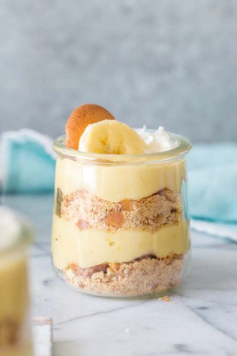 These Classic Banana Pudding Parfaits are sponsored in conjunction with #SpringSweetsWeek. I received product samples from sponsor companies to help in the creation of the #SpringSweetsWeek recipes. All opinions are mine alone. These Classic Banana Pudding Parfaits feature homemade banana pudding, wafers cookies and whipped cream for the ultimate nostalgia dessert comfort food.  Love Bananas?... Parfait Desserts Easy, Strawberry Banana Pudding Recipe, Strawberry Banana Pudding, Classic Banana Pudding, Pudding Parfait Recipes, Spring Recipes Dessert, Banana Pudding Recipe, Homemade Banana Pudding, Pudding Parfait