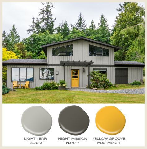 Color of the Month: Sunny Yellow! A yellow door highlights the access to this tone on tone gray house. Featured Behr Paint Colors: Light Year N370-3, Night Mission N370-7, and Yellow Groove HDC-MD-2A Yellow House Exterior, Yellow Front Doors, Best Exterior Paint, House Paint Color Combination, House Green, Gray House, Yellow Door, Exterior House Paint Color Combinations, Yellow Doors