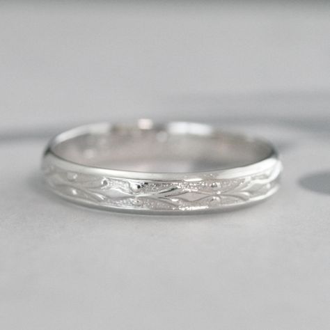 Platinum Wedding Band Edwardian Ring for Him or Her Vintage Style Wedding Ring Fleur de Lis Wedding Band Platinum Patterned Ring Our Edwardian band is both timeless and fashionable. Featuring a Fleur de Lis embossed design that encircles the band, your ring is Hand made just for you to size. The finished solid Platinum band measures 3.65mm wide by just over 1mm thick. Your ring will be meticulously hand polished to a high shine. For this design in 14K Gold: https://www.etsy.com/listing/530946184 Engraved Platinum Wedding Band, Silver Band Rings, Wedding Bands For Women Platinum, Thick Wedding Bands, Vintage Style Wedding Rings, Edwardian Ring, Wedding Band Engraving, Platinum Wedding Band, Platinum Wedding