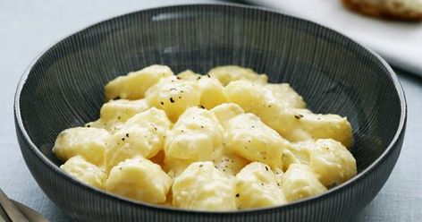 Tender homemade gnocchi in a creamy four cheese sauce is the classy comfort food you've been craving. Pumpkin Noodles, Pea Pesto, How To Make Potatoes, Homemade Gnocchi, Food For Digestion, Gnocchi Recipes, Savory Sauce, Sweet Sauce, Homemade Pasta