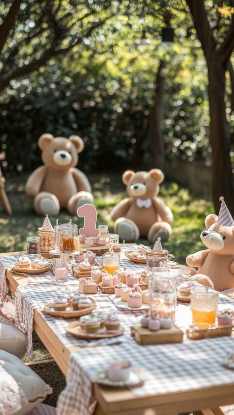 Teddy bear picnic-themed first birthday party setup with soft pink and beige decorations, large teddy bears, and a cozy outdoor picnic table. Outdoor 1st Birthday Party Ideas, Woodland Bday Party, Baby's First Birthday Party, Picnic Aesthetic Birthday Party, Nostalgic First Birthday, Picnic Themed First Birthday Party, Teddy Bear Picnic 1st Birthday Party, Picnic Theme First Birthday, Once Upon A Time Birthday Theme