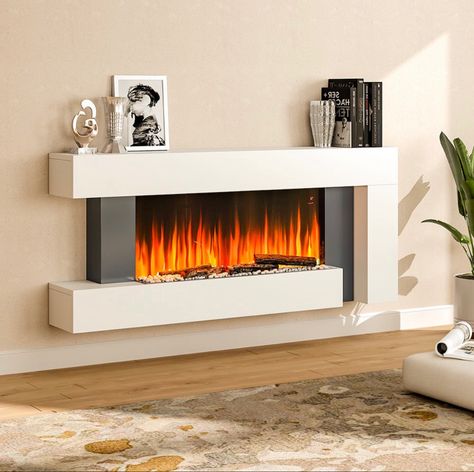 This is an elegant piece of heating appliance. The appearance is designed in a minimal way, with the white wooden frame, the simple appearance can add a touch of contemporary to any room. We deserve a cosy winter, and this fireplace provides with constant heat yet without bringing any smoke or odour. Use code JULS for extra 8% off Electronic Fireplace Ideas, Surround Fireplace, House Refurbishment, Electric Fire Suites, Recessed Electric Fireplace, Electric Fireplace Wall, Hotel Lobbies, Black Fireplace, Electric Fireplaces