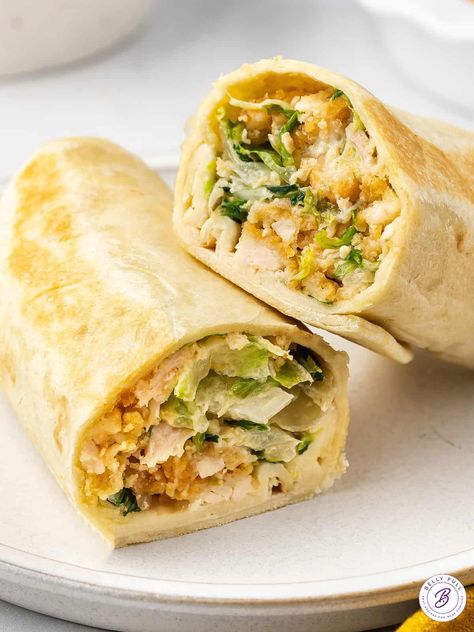 This quick and easy Chicken Caesar Salad Wrap is about to become your new best friend! Crispy chicken strips and Caesar salad are chopped, combined in a tortilla, then lightly toasted. This chicken wrap recipe is crunchy, creamy, delicious, and so satisfying. Chicken Strip Wraps Crispy, Dressing For Chicken Salad, Dressing For Chicken, Easy Asian Chicken, Dinner List, Filled Pastries, Chicken Caesar Salad Wraps, Caesar Salad Wrap, Chicken Caesar Wrap