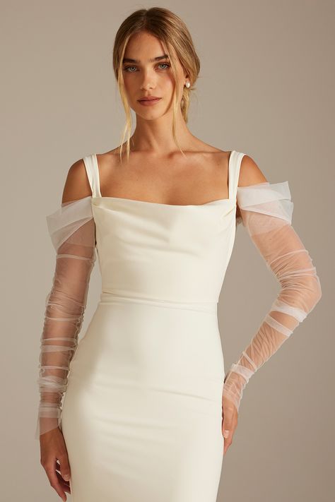 Embrace a new era of bridal elegance with the Delilah sleeve. These detachable wedding dress sleeves feature soft ivory tulle ruching for an elegant, fashion-forward bridal look.  ​

Transform your gown from ceremony to reception. Delivered with an extra set of poppers that can be hand-stitched to your gown, allowing you to effortlessly attach and detach the Deliliah sleeves on your special day. Detachable Sleeves Wedding Dress, Art Deco Wedding Dress, Wedding Dress Topper, Detachable Wedding Dress, Dress Topper, Crepe Wedding Dress, Bridal Bolero, Minimalist Wedding Dresses, Bridal Elegance