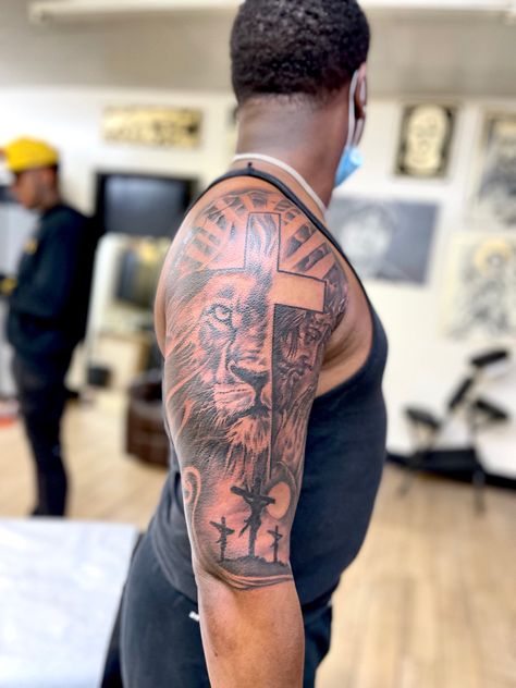 Cross Upper Arm Tattoo, Upper Arm Tattoo Men Half Sleeves Design, Mens Upper Arm Tattoo, Half Sleeve Tattoos For Men Upper Arm, Upper Arm Tattoo Men, Upper Arm Tattoos For Guys, Jesus Tattoo Sleeve, Tattoo Upper Arm, Black People Tattoos